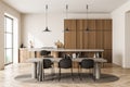 Bright kitchen room interior with dining table, six chairs