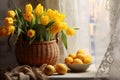 On the bright kitchen table there is a white plate with yellow painted eggs, next to them there is a basket with yellow