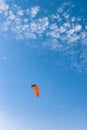 Bright kite on blue sky background. Kitesurfing on Cyprus Royalty Free Stock Photo