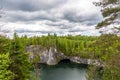 Bright Lake is a former quarry where marble was mined under a blue sky with clouds, Karelia. Russia