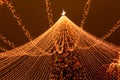 Bright lanterns on the garland glow on the tree