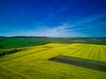Fields with a plant in a valley against the background of the village and the sky in Bulgaria Royalty Free Stock Photo