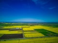 Fields with a plant in a valley against the background of the village and the sky in Bulgaria Royalty Free Stock Photo