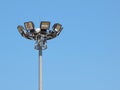 Bright large tall outdoor stadium spotlights Royalty Free Stock Photo