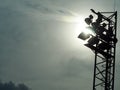 Bright large tall outdoor stadium spotlights Royalty Free Stock Photo