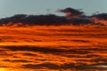 Bright orange clouds at sunset, like lava. Royalty Free Stock Photo