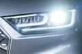 Bright led headlight of gray car Royalty Free Stock Photo