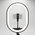 Bright led ring light illuminates smartphone for professional content creation and photography Royalty Free Stock Photo