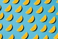 Bright lemon pattern flat lay on blue background