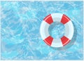 Bright lifebuoy lies on the water in a blue pool Royalty Free Stock Photo