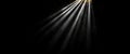 Bright light beams shining through dark background creating dramatic effect with particles This high resolution image captures Royalty Free Stock Photo