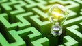 Bright Light Bulb Illuminating the Center of a Green Maze Solution Royalty Free Stock Photo