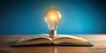 Bright light bulb on the open book for smart idea learning concept Generative AI Royalty Free Stock Photo