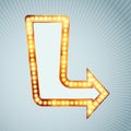 Bright light bulb pointing arrow sign