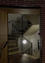 A bright light iluminates a dark stairwell