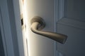 Bright light from open door and stainless steel doorknob Royalty Free Stock Photo