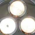 Bright light shines in the operating room. Metal surgical lamp