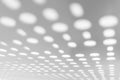 Bright light through white metal panel for blurred abstract pattern and blurred background. Royalty Free Stock Photo