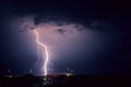 Bright lightning bolt with side branches strikes down in lake IJsselmeer, The Netherlands Royalty Free Stock Photo