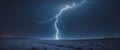 Bright lightning bolt touching down on open desert landscape at night with dark sky. Royalty Free Stock Photo