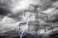 Bright lightning bolts from electric power pylon tower.  Electricity discharge clouds Royalty Free Stock Photo