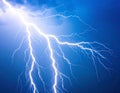 Bright Lightning Strike Across Blue Night Sky Royalty Free Stock Photo