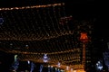 Bright lights on Ben Gurion street of Haifa city in Israel, view of the Bahai temple. hanging garlands and festive decorations Royalty Free Stock Photo