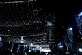 Bright lights on Ben Gurion street of Haifa city in Israel, view of the Bahai temple. hanging garlands and festive decorations Royalty Free Stock Photo