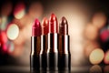 Bright lipstick of different colors shades of colored lipstick for lips. Professional makeup tool, blurred background Royalty Free Stock Photo