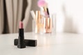 Bright lipstick on dressing table