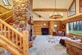 Bright Living room interior in American log cabin house.