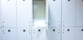 bright lockers for clothes located in two rows on the wall Royalty Free Stock Photo