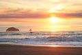 Bright luminous early sunset over Rocky outcrops on Oregon Coast