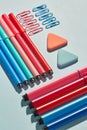 Bright markers and paper clips on a blue background Royalty Free Stock Photo