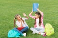 Bright memories. funny and happy sisters in playful mood. writing girlish diary. childhood memories. having rest after Royalty Free Stock Photo