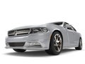 Bright metallic silver modern fast car - low angle epic shot Royalty Free Stock Photo