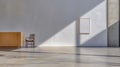 Bright, minimal interior space with wooden desk and empty frame casting shadows in natural light Royalty Free Stock Photo