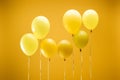 Bright minimalistic decorative balloons on yellow background.