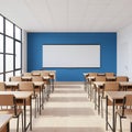 A brightly lit empty classroom with modern wood desks Royalty Free Stock Photo
