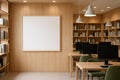 A bright, modern library features a long wooden table with several computers, showcasing a blend of traditional warmth and Royalty Free Stock Photo