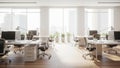 Bright Modern Office Interior with Rows of White Desks and Large Windows workspace Royalty Free Stock Photo
