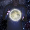 Bright moon hovers between mans palms Royalty Free Stock Photo