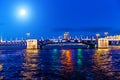 Bright moon over the Troitskiy  Bridge over the Neva River with night illumination. Saint-Petersburg. Russia Royalty Free Stock Photo