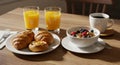 Bright Morning Breakfast with Orange Juice and Pastries Royalty Free Stock Photo