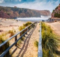 Bright morning view of Cala Domestica beach. Attractive summer scene of Sardinia, Italy, Europe. Footbridge in Canyon di Cala Dome Royalty Free Stock Photo