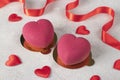 Homemade bright mousse cakes Hearts with pink velor coating for Valentine's Day