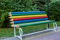 Bright multi-color pencil rainbow bench in park Royalty Free Stock Photo