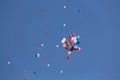 Bright multi-colored balloons in the blue sky