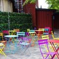 Bright multi-colored chairs and tables on the terrace of an outdoor cafe Royalty Free Stock Photo