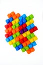 Bright multi-colored children`s designer on a white background. Interesting educational games for children. Place for